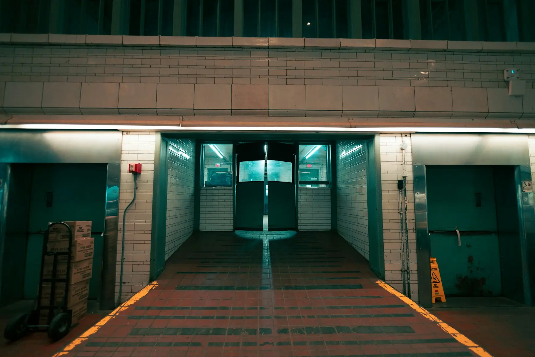 The entrance to a cold-storage building, lit at night.